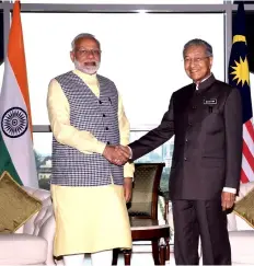  ?? — Bernama photo ?? Dr Mahathir shakes hand with Modi during the Indian PM’s visit to his office at Bangunan Perdana Putra.