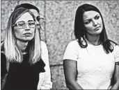  ?? DREW ANGERER/GETTY ?? Annie Farmer, left and Courtney Wild listen as their lawyers speak to the media Monday outside court in New York.