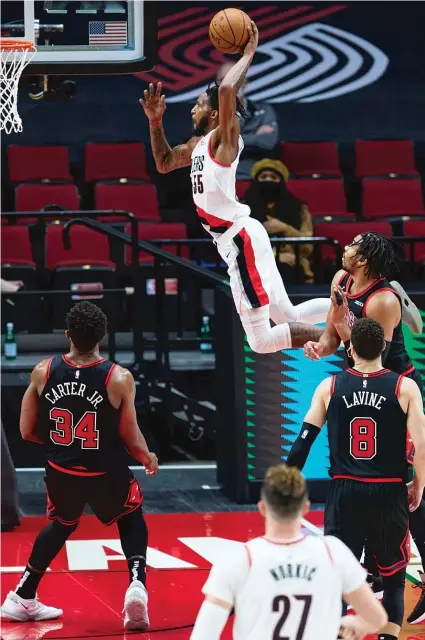  ?? CRAIG MITCHELLDY­ER/AP ?? Forward Derrick Jones Jr. victimized the Bulls with this dunk last season as a member of the Trail Blazers, but he’s on their side now.
