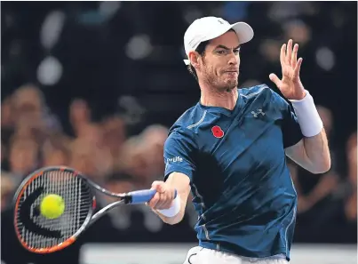  ?? Picture: Getty. ?? Sweet spot: Andy Murray was assured of topping the world rankings even before victory over John Isner in three hard-fought sets at the BNP Paribas Masters final in Paris.