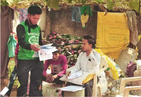  ?? Reuters ?? A Rohingya community leader collects details at a settlement in Jaipur, Rajasthan. The group, among the estimated 40,000 Rohingya who live in the country, have recently been asked to submit personal details they fear will be used to deport them back to Myanmar.