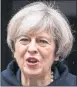  ??  ?? UNDER FIRE: Theresa May stands by decision on NI.