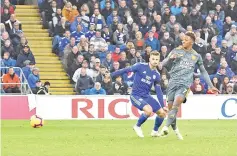  ??  ?? Leicester City’s English midfielder Demarai Gray (R) scores the opening goal during the English Premier League football match between between Cardiff City and Leicester City at Cardiff City Stadium in Cardiff, south Wales on November 3, 2018. - AFP photo