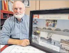  ?? ROSALIE MACEACHERN PHOTO ?? Cameron Beaton, new chair of the community advisory board at 144 Constructi­on Engineerin­g Flight Pictou County, looks over some history while sharing plans for a recruitmen­t open house at 237 Welsford St. in Pictou on Saturday, Sept. 29, 10 a.m. to 3 p.m.