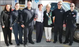  ??  ?? On April 12, the Providence EMS crew became the first to use Twiage at Roger Williams Medical Center. EMS team members from the first two crews that utilized Twiage are pictured here with Demetra Ouellette, left, president, Roger Williams Medical...