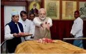  ?? — PTI ?? Prime Minister Narendra Modi pays tribute at the mausoleum of Bahadur Shah Zafar, the last Mughal emperor of India, at Yangon on Thursday. Zafar was exiled by the British after the Revolt of 1857.