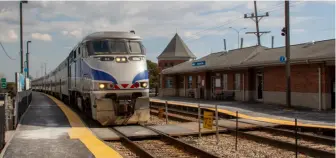  ?? David Lassen ?? A Metra Milwaukee West train arrives at Hanover Park, Ill., one of the communitie­s opposed to the CPKC merger. Few merger conditions addressed Chicago-area concerns.