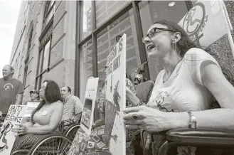  ?? Godofredo A. Vasquez / Houston Chronicle ?? Lydia Nunez Landry, right, chants with fellow members of American Disabled Attendant Programs Today outside U.S. Sen. Ted Cruz’s office during a protest against the GOP’s health care plans.