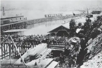  ??  ?? The first Canadian Pacific Railway train arrived in Vancouver on this day in 1887 along a trestle over the tidal flats at the Gastown shore.