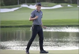  ?? PHELAN M. EBENHACK-THE ASSOCIATED PRESS ?? Collin Morikawa celebrates after putting on the 18th green to win the Workday Championsh­ip golf tournament Sunday, Feb. 28, 2021, in Bradenton, Fla.