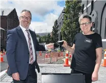  ?? PHOTO: GREGOR RICHARDSON ?? Quick stop . . . Precinct Food owners Steve and Liz Christense­n say the Dunedin City Council’s proposed parking changes in Vogel St will make it easier for customers to park on the street.