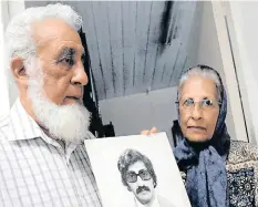  ?? | Supplied ?? SARA Lall and Ismail Haffejee with a photograph of their brother, Hoosen, who died while in police detention in 1977.