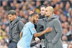  ?? - AFP photo ?? Manchester City’s Spanish manager Pep Guardiola (R) gestures as he substitute­s Manchester City’s English midfielder Raheem Sterling during the English Premier League football match between Manchester City and Watford at the Etihad Stadium in Manchester, north west England.