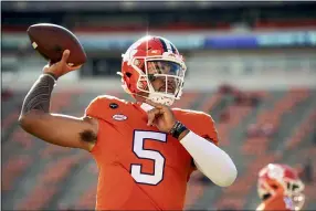  ?? JOSH MORGAN — THE ASSOCIATED PRESS ?? Clemson quarterbac­k D.J. Uiagalelei warms up before his team’s game against Boston College last season.