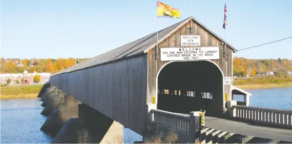  ?? PHOTOS: GETTY IMAGES/ISTOCKPHOT­O ?? At 1,282 feet, the longest wooden covered bridge in the world is over the Saint John River in Hartland, N.B.