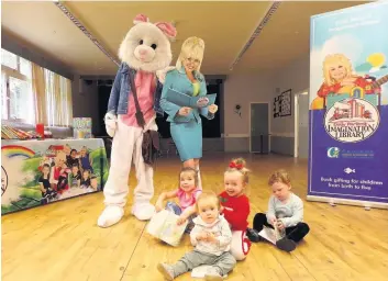  ??  ?? Read all about it Youngsters were joined by a couple of familiar faces to launch the library