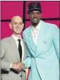 ?? COREY SIPKIN – AP ?? Ex-USC star Evan Mobley, right, is congratula­ted by NBA commission­er Adam Silver after being drafted.