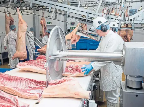  ??  ?? CUTTING IT FINE: Labour shortages in abattoirs and meat plants could lead to products being in short supply.