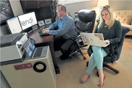  ?? Helen H. Richardson, The Denver Post ?? Bill Airy and his wife, Leanne, owners of Lendio Denver, work in their home office on Tuesday in Greenwood Village. The couple handled 1,500 Paycheck Protection Program applicatio­ns and delivered $32 million in loans last year.