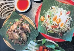 ??  ?? BELOW Deep fried chicken wings and green papaya salad with salted egg.