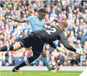  ??  ?? Gabriel Jesus scores the second of his two goals.