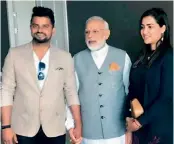  ??  ?? Former Indian cricketer Suresh Raina (from left), Indian Prime Minister Narendra Modi and Raina’s wife Priyanka Chaudhary in this file photo.