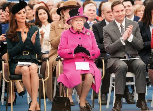  ??  ?? High profile: The Queen and Duchess of Cambridge sit with Dominic Shellard during a visit to De Montfort University in 2012