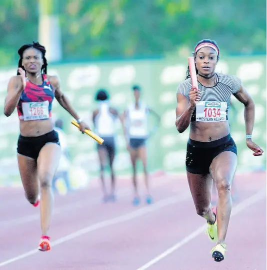  ?? FILE ?? Elaine Thompson (right) anchoring the MVP team to victory in the Women’s 4x100 metres relay at the Milo Western Relays at the Montego Bay Sports Complex in 2017.