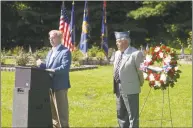  ?? H John Voorhees III / Hearst Connecticu­t Media ?? Mayor Mark Boughton speaks during the Danbury Council of Veterans World War II 73rd Anniversar­y and Remembranc­e Ceremony, hosted by the Catholic War Veterans Danbury Post 1042, in the Rose Garden of Rogers Park on Wednesday morning. CWV Post 1042 Commander Albert Mead looks on.