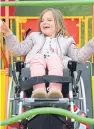 ??  ?? Jessica Lessells, 6, enjoying the wheelchair swing.