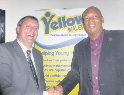  ??  ?? Yellow Wales’ manager Steve Driscoll with Sported chief executive Chris Grant, at the launch of the charity’s impact report