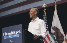  ?? Bloomberg ?? Barack Obama told a rally in Anaheim, California, he was backing seven Democrat candidates to win Republican seats