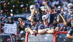  ?? ASSOCIATED PRESS FILE PHOTO ?? Mississipp­i baseball players celebrate its College World Series national championsh­ip in a parade in Oxford, Miss. last year.
