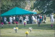  ?? AP/JOHN MINCHILLO ?? Mourners gather Saturday at the grave site of Tyre King, 13, who was fatally shot by a police officer in Columbus, Ohio.