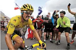  ?? AP Photo/ Christophe Ena ?? ■ France’s Julian Alaphilipp­e wearing the overall leader’s yellow jersey climbs the Galibier pass Thursday during the 18th stage of the Tour de France. The 130-mile stage started in Embrun and ended in Valloire.