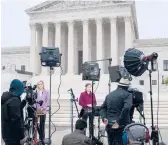  ?? J. SCOTT APPLEWHITE/AP ?? Television news crews stake out the Supreme Court last week following the Politico news report of a draft opinion to overturn Roe v. Wade.