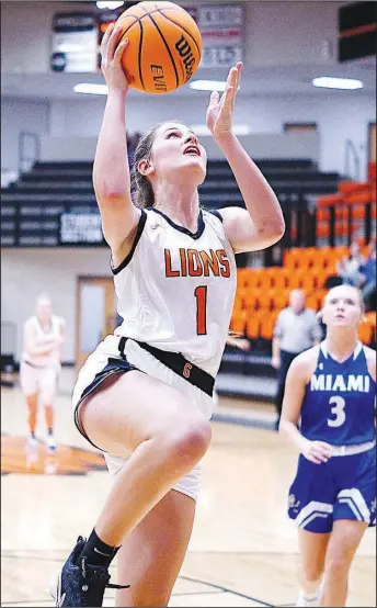  ?? Westside Eagle Observer/RANDY MOLL ?? Dalacie Wishon shoots from under the basket for Gravette during a Dec. 6 game against Miami, Okla., at Gravette High School.