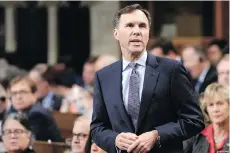  ?? ADRIAN WYLD/THE CANADIAN PRESS ?? Finance Minister Bill Morneau is pushing to advance his controvers­ial proposed law on target benefit plans.