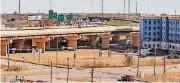  ?? [PHOTO BY CHRIS LANDSBERGE­R, THE OKLAHOMAN] ?? The vacant southeast corner of Sheridan Avenue and Lincoln Boulevard, nestled against Interstate 235, is set to be sold at auction on Friday.