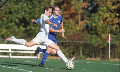  ?? H John Voorhees III / Hearst Connecticu­t Media ?? New Milford’s Nathaniel Cramer scores a goal ahead of Abbott Tech’s Tyler Waterman in the boys soccer game Thursday afternoon at Broadview Middle School in Danbury. New Milford won, 5-1.