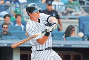  ?? ANDY MARLIN/USA TODAY SPORTS ?? Yankees third baseman DJ Lemahieu hits a game-winning home run against the Athletics on Aug. 31 in New York.