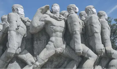  ?? Picture: AFP ?? Statues of the Monumento das Bandeiras wear masks in Sao Paulo, Brazil, during the coronaviru­s pandemic. Brazil has emerged as the epicentre of the pandemic in Latin America, with 11 519 deaths.