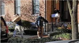  ?? DANIEK KONIK/STATEHOUSE NEWS BUREAU VIA OCJ ?? FBI agents remove boxes of materials from PUCO Chairman Sam Randazzo’s condo in Columbus Nov. 17, 2020.