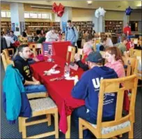  ?? BOB KEELER — DIGITAL FIRST MEDIA ?? About 115 Souderton Area High School students and 41 U.S. military veterans took part in the Nov. 10 Veterans Day Luncheon. Held in the school library, the luncheon was organized by the school’s Interact Club and Support Our Troops Club.
