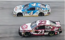  ?? WADE PAYNE, THE ASSOCIATED PRESS ?? Kevin Harvick (4) passes David Ragan en route to victory at the NASCAR Sprint Cup Series race in Bristol, Tennessee, on Sunday.