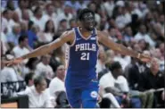  ?? LYNNE SLADKY — THE ASSOCIATED PRESS ?? The 76ers’ Joel Embiid (21) celebrates after shooting a 3-pointer during the second half Thursday in Miami.