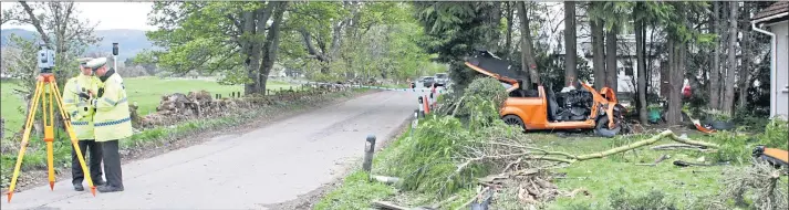  ??  ?? Martin Cameron’s wrecked orange Ford Focus lies at the side of the B851 at Farr, near Inverness, as police investigat­e. Cameron was driving in excess of 60mph in a 40mph zone