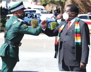  ??  ?? President Mnangagwa congratula­tes the best cadet Munyaradzi Muchemwa during the 36th Officer Cadet course graduation ceremony at the Zimbabwe Military Academy in Gweru yesterday