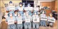  ?? Contribute­d photo ?? Yale New Haven Hospital staff display the message “United and always hopeful, here for you #CrushCovid.”