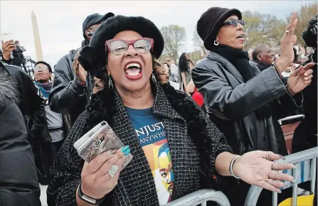  ?? JACQUELYN MARTIN
THE ASSOCIATED PRESS ?? Wearing a T-shirt commemorat­ing Martin Luther King Jr., Debra Payne, of Kansas City, Mo, sings at a rally in Washington,D.C.